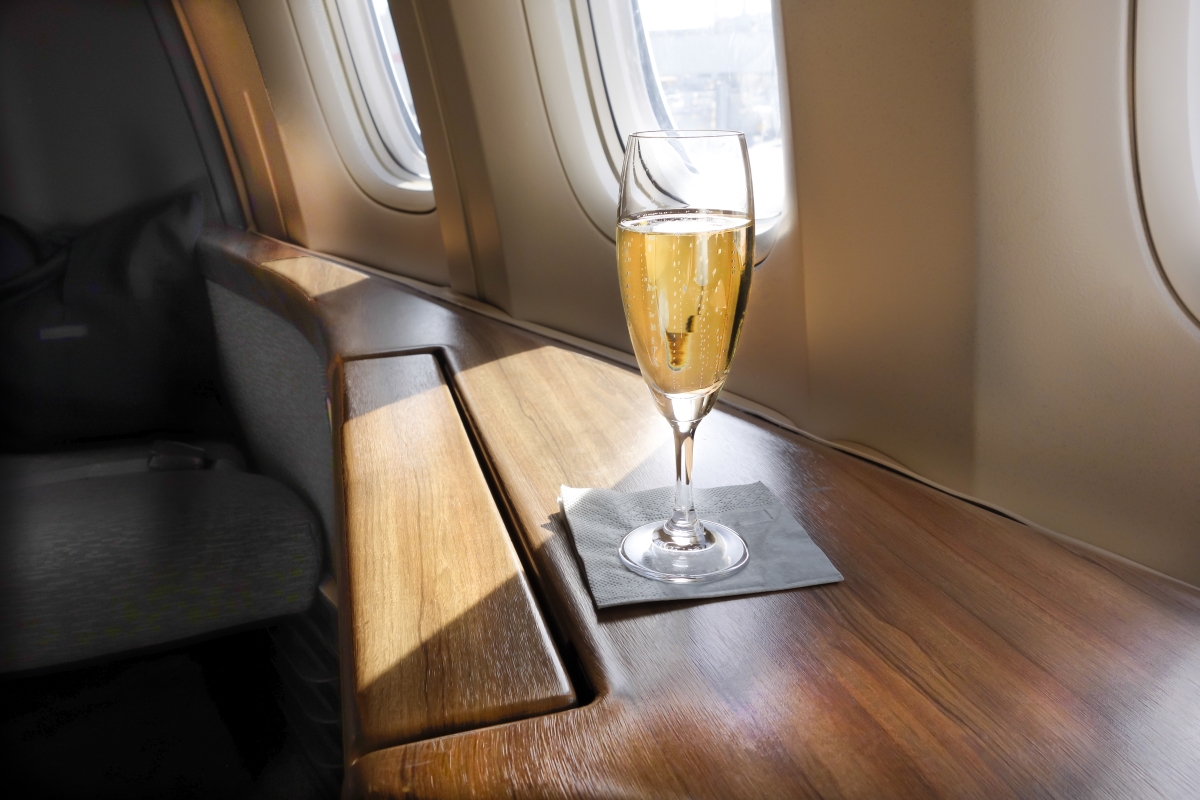 Glass of champagne on a plane table